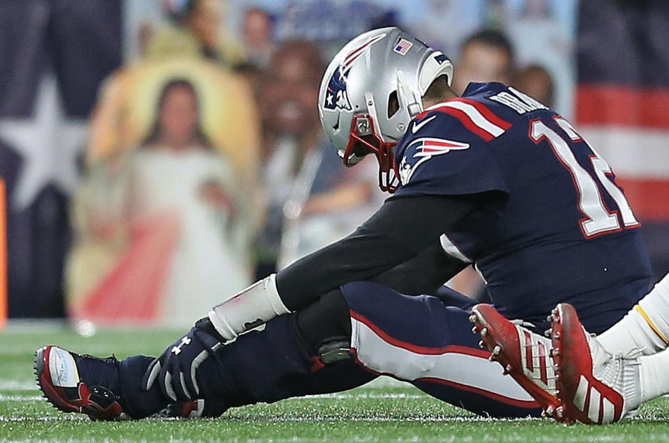 FOXBORO, MA. - DECEMBER 8:  Tom Brady #12 of the New England Patriots after getting sacked during the first quarter of the NFL game against the Kansas City Chiefs on December 8, 2019 in Foxboro, Massachusetts. (Staff Photo By Matt Stone/MediaNews Group/Boston Herald)