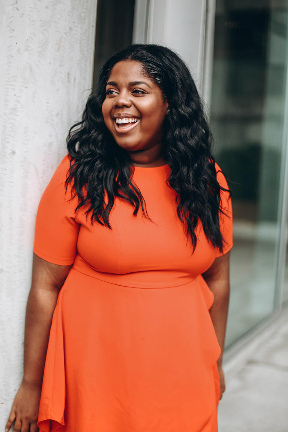 Hayet Rida in a bright orange dress. (Photo: Courtesy of Hayet Rida)