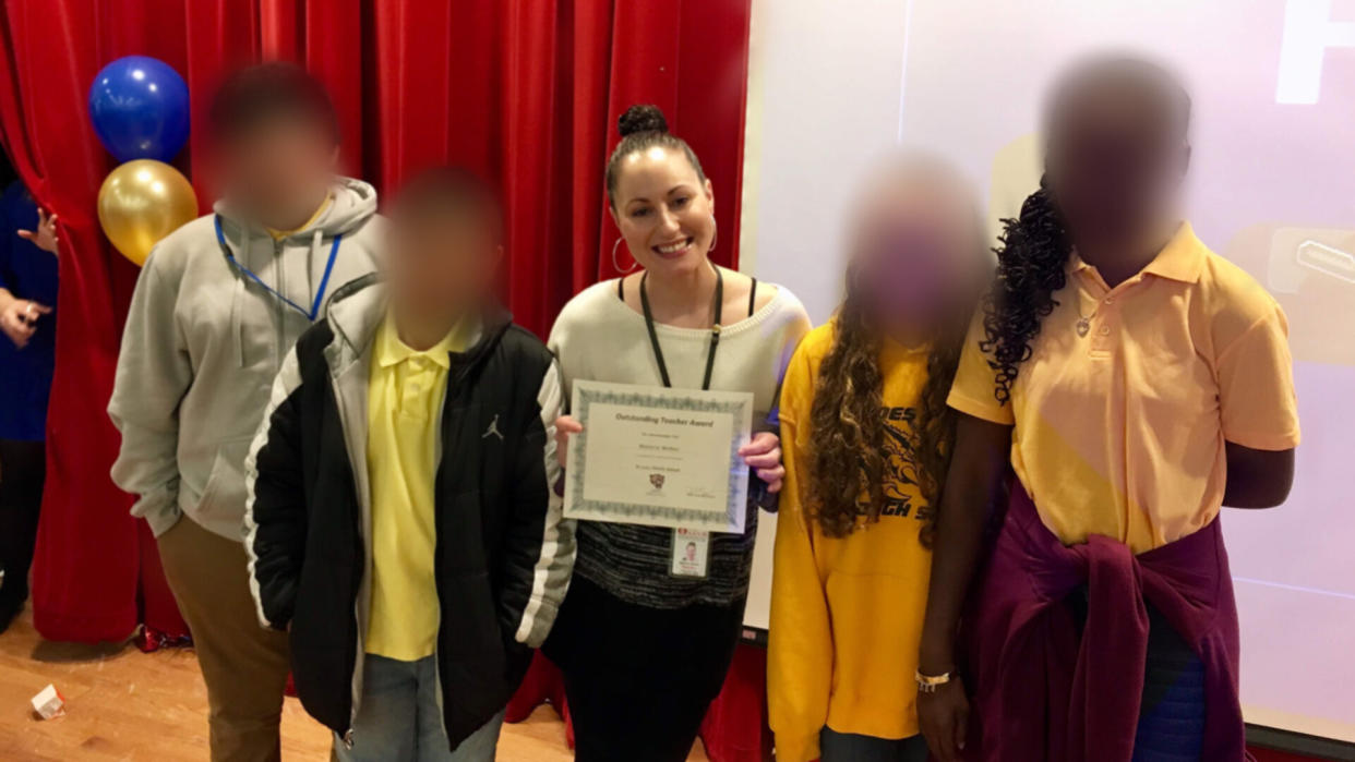 Malorie Weber poses with students after being presented an outstanding teacher award. (Credit: Malorie Weber)