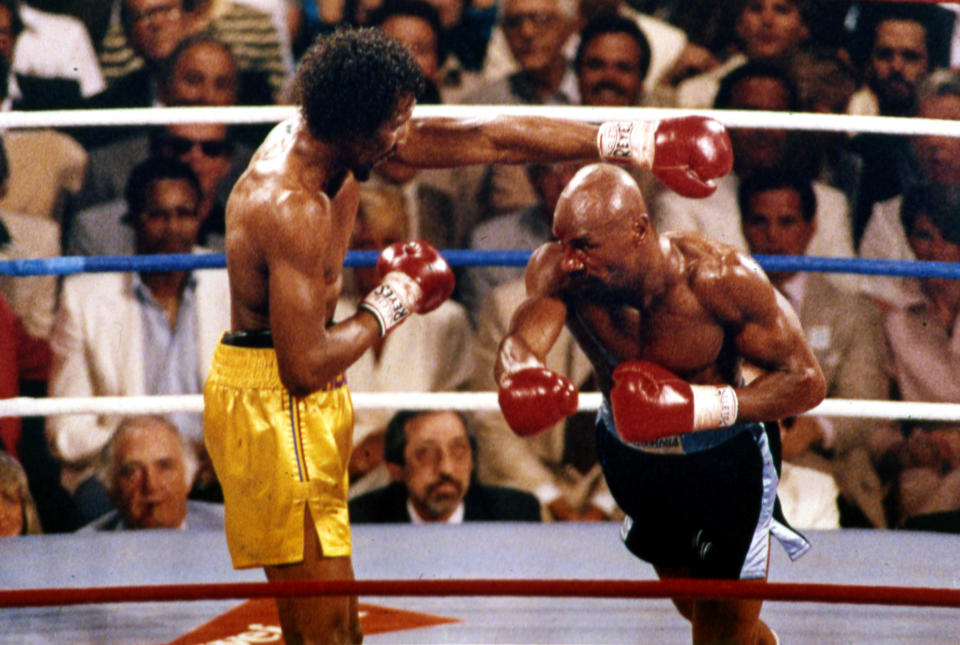 Marvin Hagler, right, and Thomas Hearns in action during the first round of the World Middleweight Championship boxing in Las Vegas, April 15, 1985. (AP Photo)