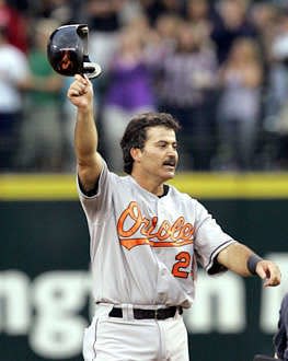 Baltimores Rafael Palmeiro tips his helmet after collecting his 3,000th career hit in Seattle on July 15. Palmeiro was suspended for violating baseballs steroids policy Monday. Elaine Thompson | Associated Press