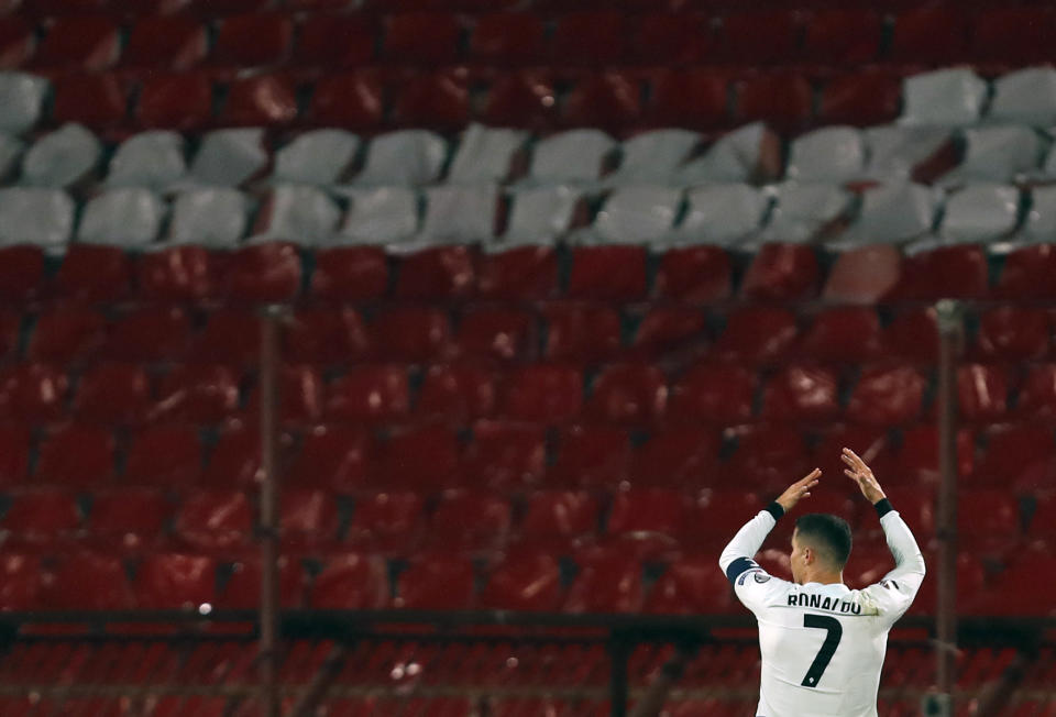 Portugal's Cristiano Ronaldo wearing his captain's armband reacts during the World Cup 2022 group A qualifying soccer match against Serbia at the Rajko Mitic stadium in Belgrade, Serbia, Saturday, March 27, 2021. The captain’s armband which Cristiano Ronaldo threw to the pitch after his overtime winning goal was disallowed in a World Cup qualifier against Serbia has been put on auction Tuesday March 30, 2021. The armband is being auctioned by a charity group raising money for surgery of a six-month-old boy from Serbia suffering spinal muscular atrophy. (AP Photo/Darko Vojinovic)