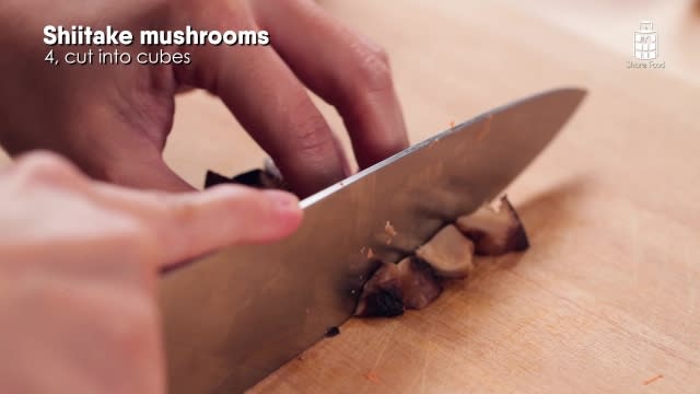 Chopping mushrooms into small pieces