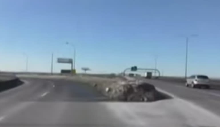 You read it right, the guy flies off an on-ramp. This is what happens when you drink and drive, one moment you're the "best intoxicated driver in the world," the next you find yourself flying off the road and pile-driving your car into the ground