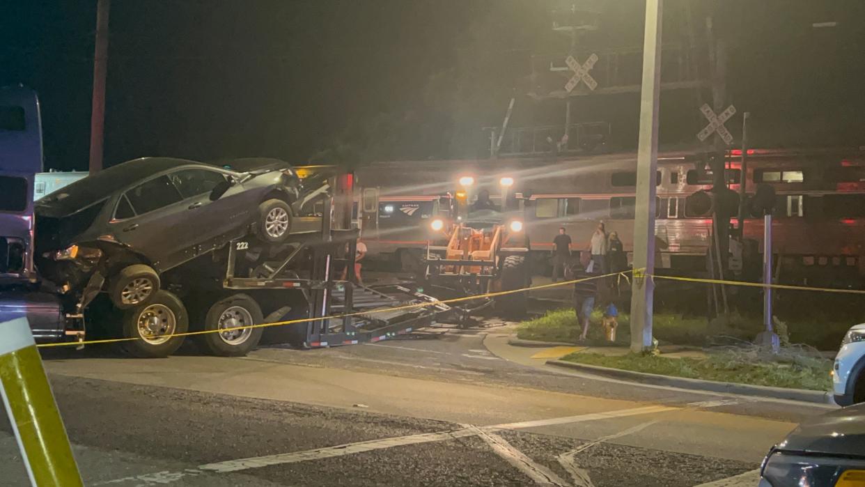 The scene of a crash Friday night in which an Amtrak train collided with a tractor-trailer that was carrying automobiles on North Canal Avenue in Lakeland.