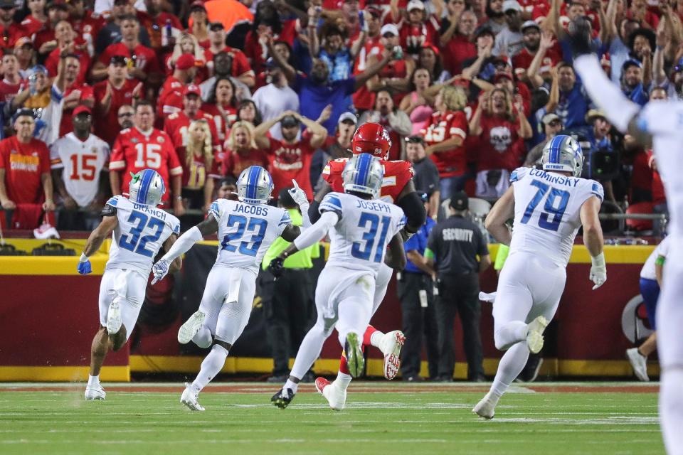 Detroit Lions safety Brian Branch (32) runs for a touchdown after making an interception from Kansas City Chiefs quarterback Patrick Mahomes (15) during the second half at Arrowhead Stadium in Kansas City, Mo. on Thursday, Sept. 7, 2023.
