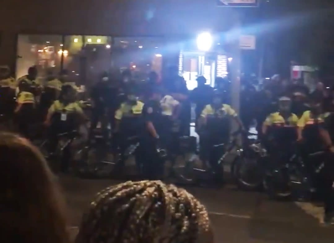 Police officers with bicycles stand near the corner of Hudson and West 10th streets in New York City on Sept. 26, 2020. (Molly Dillon via Twitter)