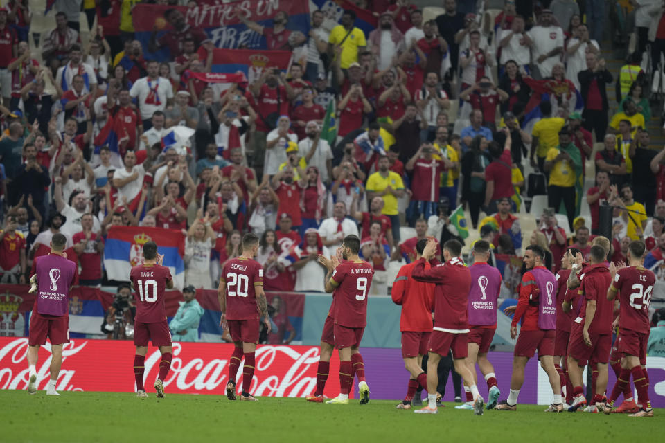 Serbia's players greet their fans at the end of the World Cup group G soccer match between Brazil and Serbia, at the Lusail Stadium in Lusail, Qatar, Thursday, Nov. 24, 2022. (AP Photo/Aijaz Rahi)