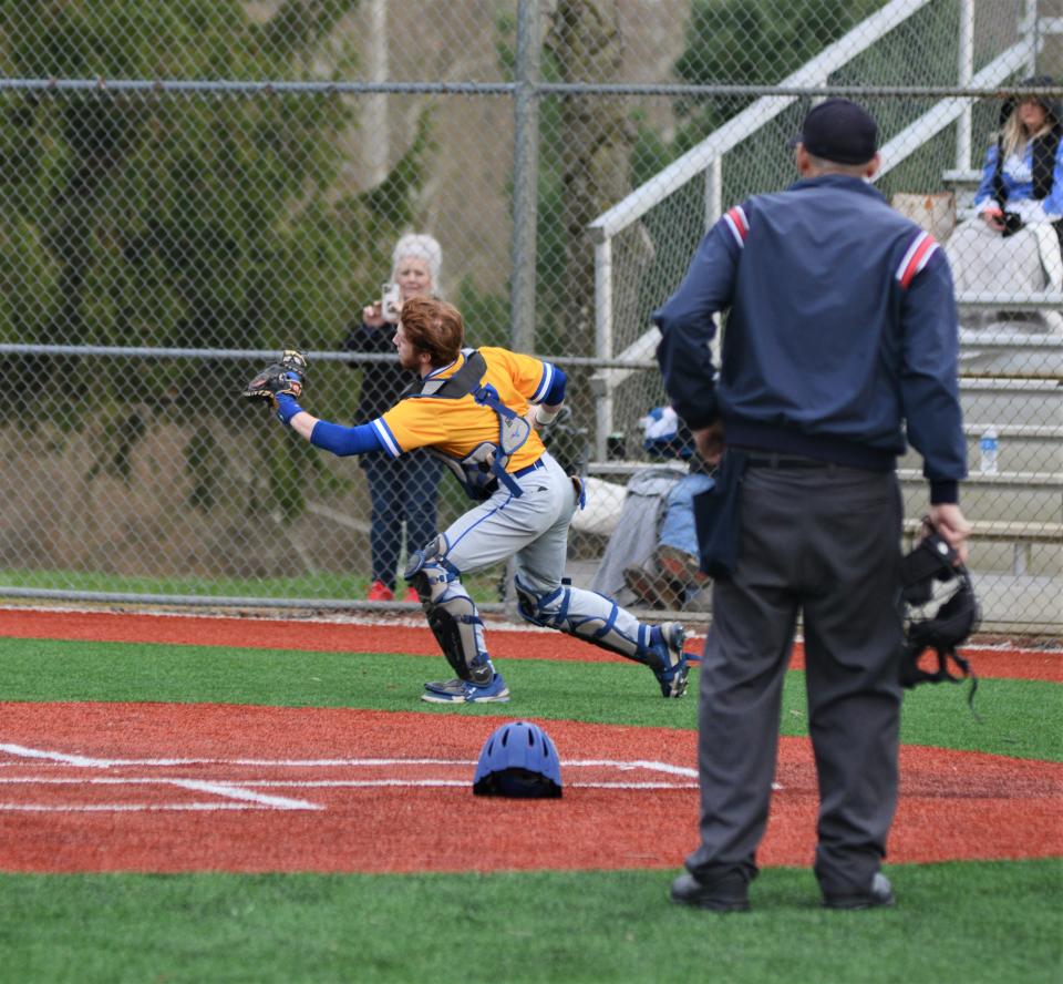 Philo catcher Jacob Howell catches a foul popup during Friday's game with Zanesville. The Electrics moved their winning streak to three games with a 12-3 victory.
