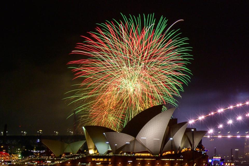 Fireworks explode over the Opera House, which is also marking its 50th anniversary (AFP via Getty Images)
