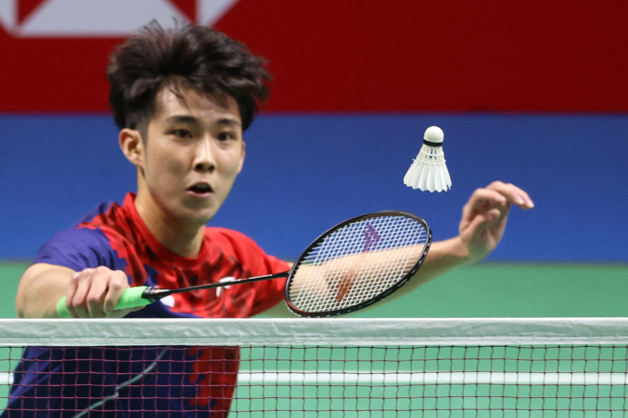 Singapore's Loh Kean Yew hits a shot to India's Kidambi Srikanth during the men's singles final at the BWF World Championships in Huelva