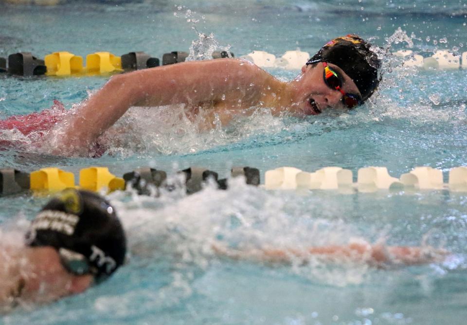 Ithaca's Koen Anderson, top, finished first and Corning's Aiden Spoors, front, second in the 500-yard freestyle at the Section 4 Class A boys swimming and diving championships Feb. 18, 2023 at Watkins Glen High School.