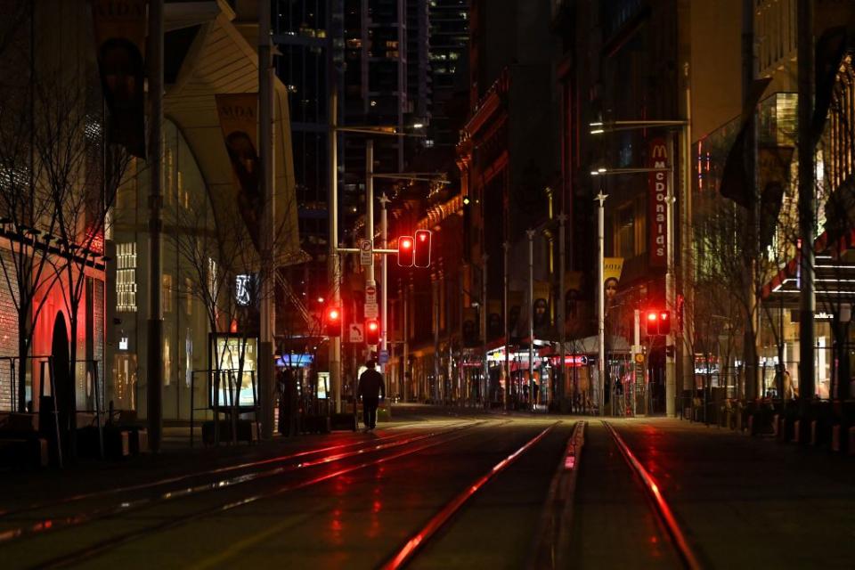 A quiet George Street promenade is pictured on a usually busy evening in Sydney after authorities ordered new restrictions as a weeks-long lockdown failed to quash an outbreak of the Covid-19 coronavirus.