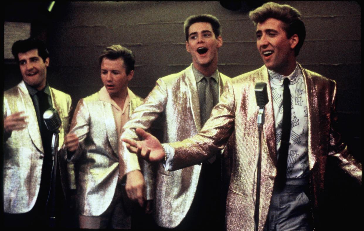 Nicolas Cage (far right, with Jim Carrey next to him) sings in "Peggy Sue Got Married."