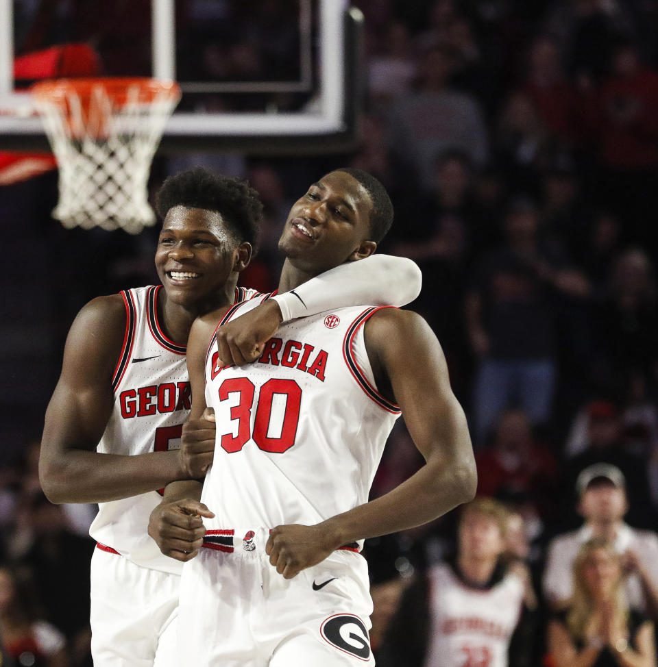 Georgia's Anthony Edwards (5) celebrates with Mike Peake (30), who drew a charge on an Alabama player during an NCAA college basketball game Saturday, Feb. 8, 2020, in Athens, Ga. (Kristin M. Bradshaw/Athens Banner-Herald via AP)