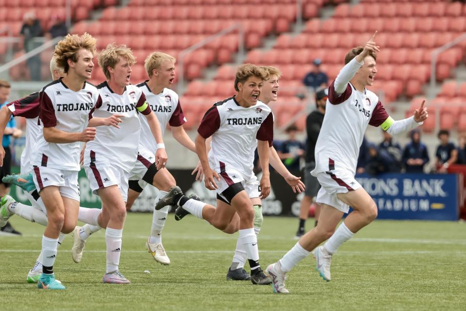 Morgan players celebrate after beating Ogden in penalty kicks in a 3A boys soccer state semifinal at Zions Bank Stadium in Herriman on Wednesday, May 10, 2023.