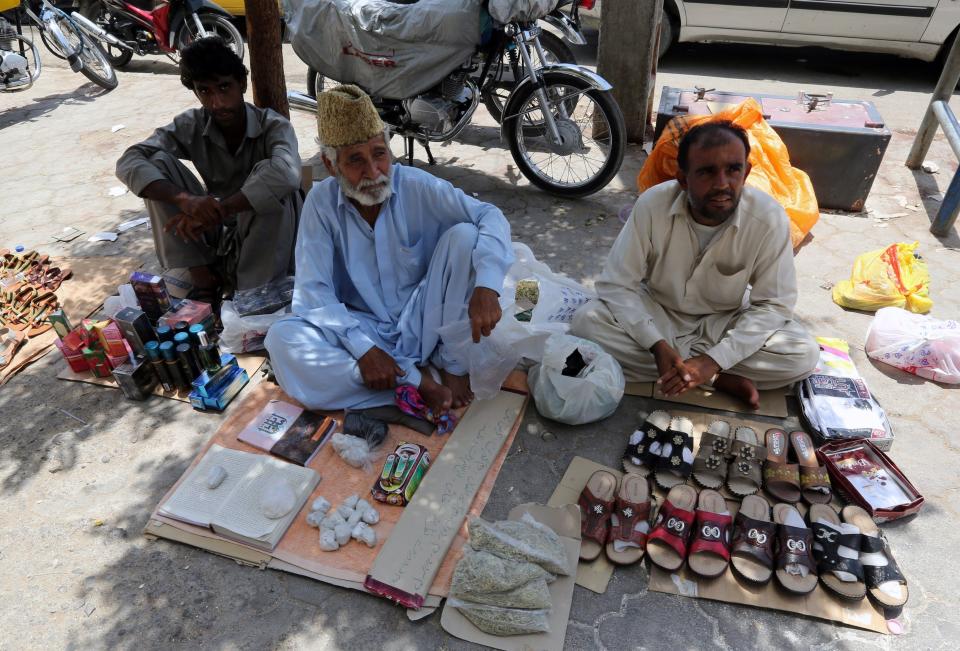 Vendors sell items on the street in Chabahar, Iran, on May 13, 2015.