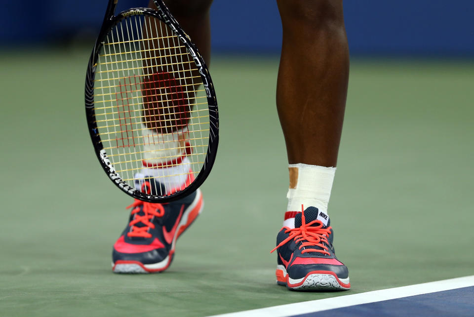 NEW YORK, NY - AUGUST 26:  The shoes of Serena Williams of the United States of America seen during her women's singles first round match against Francesca Schiavone of Italy on Day One of the 2013 US Open at USTA Billie Jean King National Tennis Center on August 26, 2013 in the Flushing neighborhood of the Queens borough of New York City.  (Photo by Elsa/Getty Images)