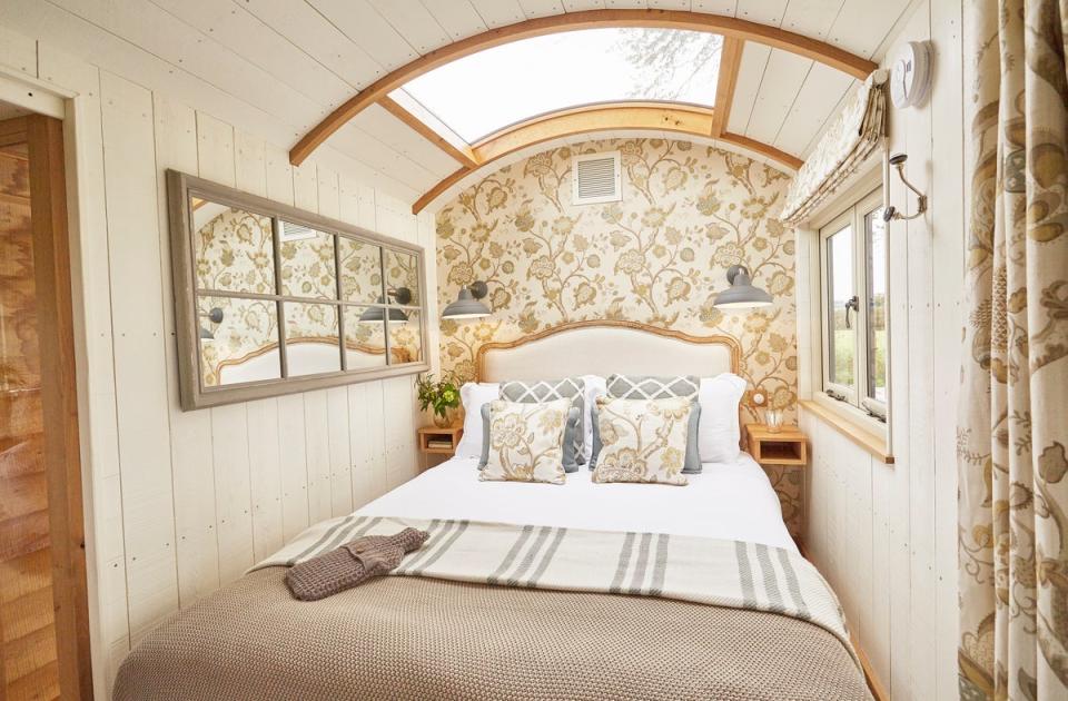 Stargaze to your heart’s content through the glass roof of this homey hut (StarBed Hideaways)