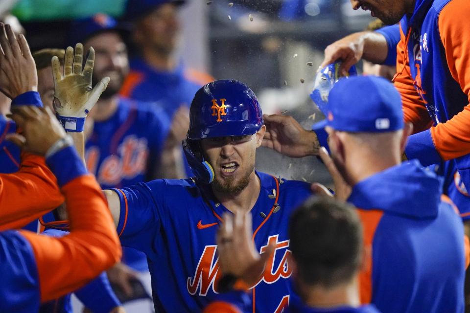 New York Mets' Patrick Mazeika celebrates with teammates after hitting a home run during the seventh inning of a baseball game against the Seattle Mariners, Saturday, May 14, 2022, in New York. (AP Photo/Frank Franklin II)