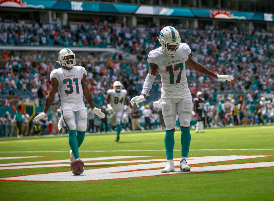 Miami Dolphins wide receiver Jaylen Waddle (17) celebrate after scoring touchdown during second quarter action of their game against New England Patriots during NFL game Sept 11, 2022, at Hard Rock Stadium in Miami Gardens.