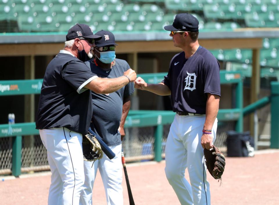 Manager Ron Gardenhire and coach Lloyd McClendon greet first-round draft pick Spencer Torkelson after his first batting practice with the Detroit Tigers at Comerica Park on July 4, 2020.