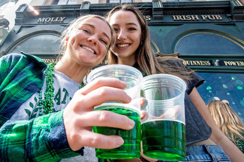 Haley Pernesky, 21, and Emma Tierney, 22, at Molly Brannigan's Irish Pub celebrating St. Patrick's Day on March 17, 2022. Local bars in Erie held St. Patrick's Day celebrations all day Thursday. 