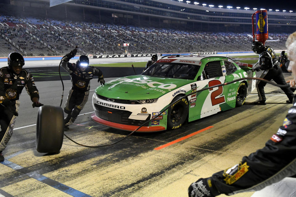 Tyler Reddick makes a pit stop during the NASCAR Xfinity Series auto race at Texas Motor Speedway in Fort Worth, Texas, Saturday, Nov. 2, 2019. (AP Photo/Larry Papke)