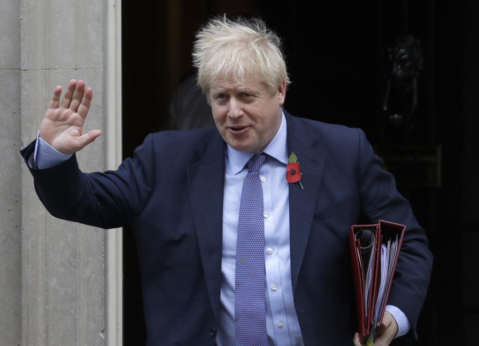 Britain's Prime Minister Boris Johnson leaves 10 Downing Street to attend Parliament in London, Wednesday, Oct. 30, 2019. Britons will be heading out to vote in the dark days of December after the House of Commons on Tuesday backed an early national vote that could break the country's political impasse over Brexit — or turn out to be merely a temporary distraction. (AP Photo/Kirsty Wigglesworth)