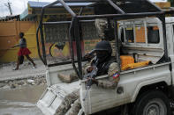 Security forces patrol the streets of Croix-des-Bouquets, near Port-au-Prince, Haiti, Tuesday, Oct. 19, 2021. A general strike continues in Haiti demanding that authorities address the nation’s lack of security, four days after 17 members of a U.S.-based missionary group were abducted by a gang. (AP Photo/Matias Delacroix)