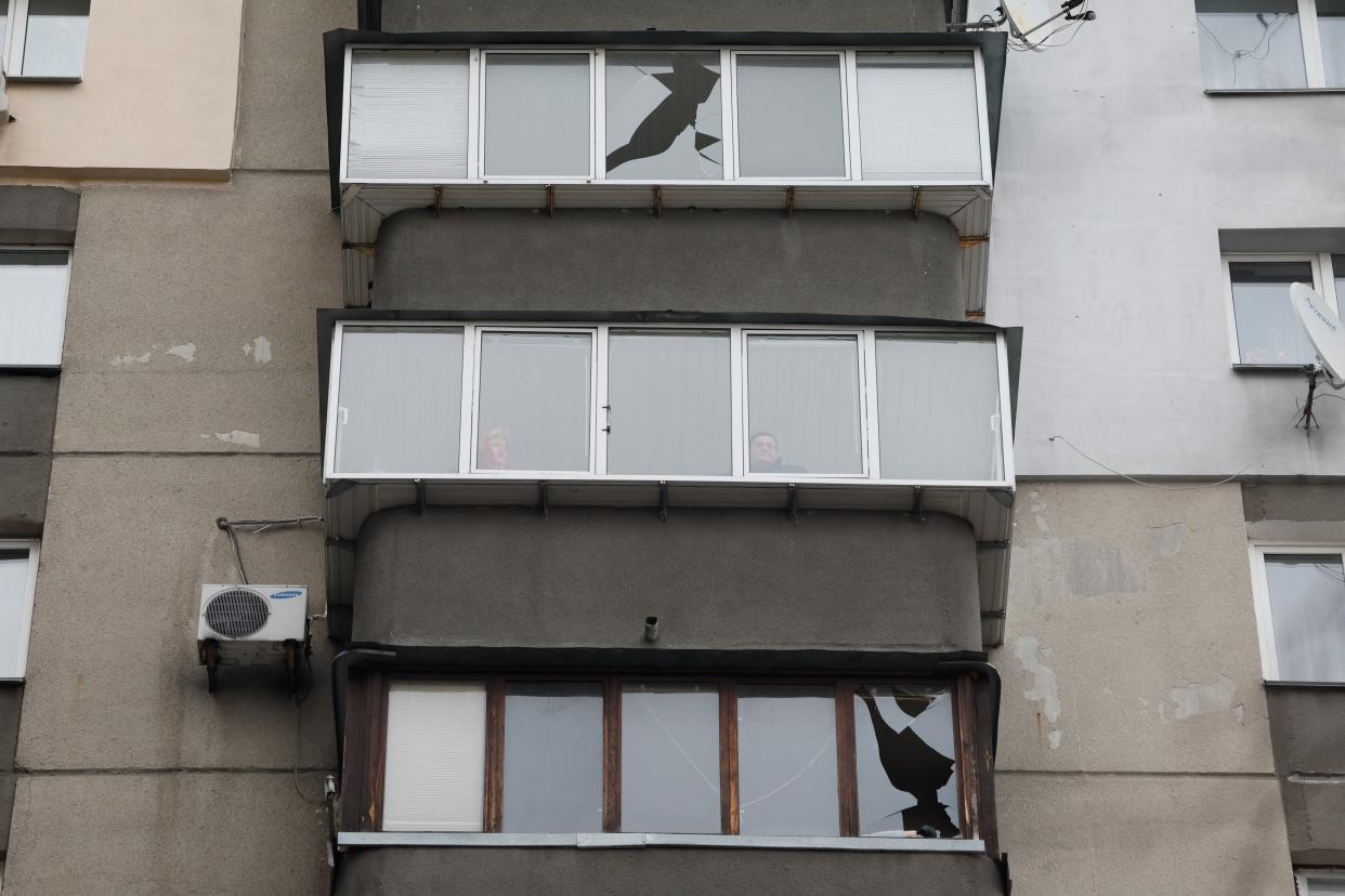 A view of damaged windows of a building rattled at the site of a Russian missile strike in Kyiv this morning (Reuters)