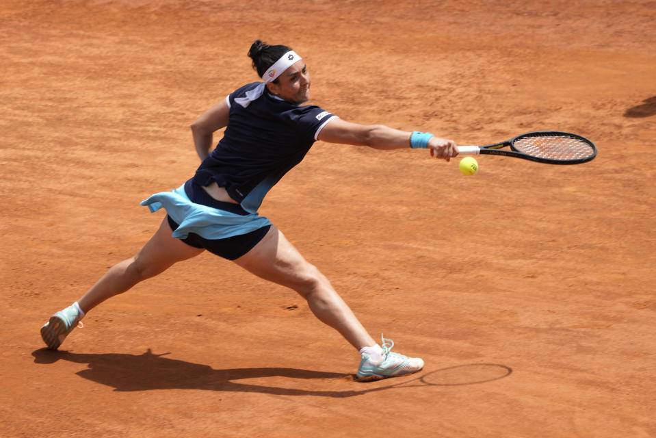 Turkey's Ons Jabeur returns the ball to Poland's Iga Swiatek during their final match at the Italian Open tennis tournament, in Rome, Sunday, May 15, 2022. (AP Photo/Alessandra Tarantino)