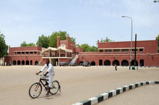 A cyclist rides past the palace of Shehu of Bornu, the traditional ruler of Bornu in Maiduguri, in northeastern Nigeria in May 2012. Maiduguri has been one of the targets of Boko Haram's deadly assaults, with scores of people killed in recent months