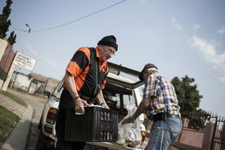 Adriaan Vlok, former South African apartheid law and order minister who oversaw a brutal police crackdown, delivers free food around a township as he seeks to atone for his sins