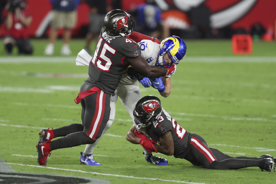 Los Angeles Rams wide receiver Cooper Kupp (10) is stopped by Tampa Bay Buccaneers inside linebacker Devin White (45) and cornerback Sean Murphy-Bunting (23) during the first half of an NFL football game Monday, Nov. 23, 2020, in Tampa, Fla. (AP Photo/Mark LoMoglio)