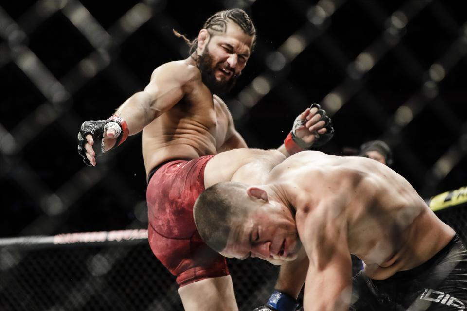 Jorge Masvidal, left, kicks Nate Diaz during the first round of a welterweight mixed martial arts bout at UFC 244 early Sunday, Nov. 3, 2019, in New York. Masvidal stopped Diaz in the fourth round. (AP Photo/Frank Franklin II)