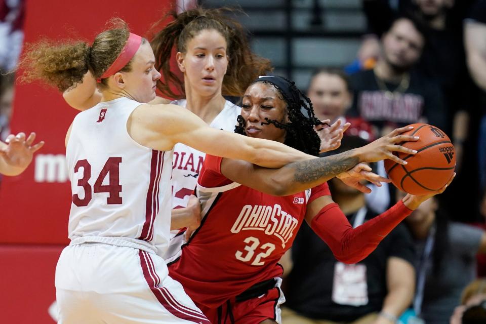 Ohio State's Cotie McMahon (32) is defended by Indiana's Grace Berger (34) during the second half of an NCAA college basketball game, Thursday, Jan. 26, 2023, in Bloomington, Ind. (AP Photo/Darron Cummings)