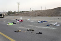 FILE - Israelis killed by Hamas militants lie on the road near Sderot, Israel, on Saturday, Oct. 7, 2023. Maj. Gen. Aharon Haliva, the head of Israel's military intelligence directorate resigned on Monday April 22, 2024 over the failures surrounding Hamas' unprecedented Oct. 7 attack, the military said, becoming the first senior figure to step down over his role in the deadliest assault in Israel's history. (AP Photo/Ohad Zwigenberg, File)