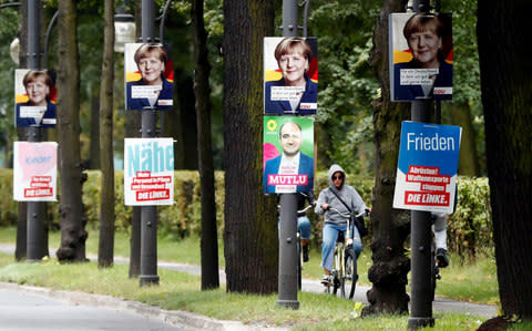 Merkel campaign posters - Credit: Fabrizio Bensch / Reuters