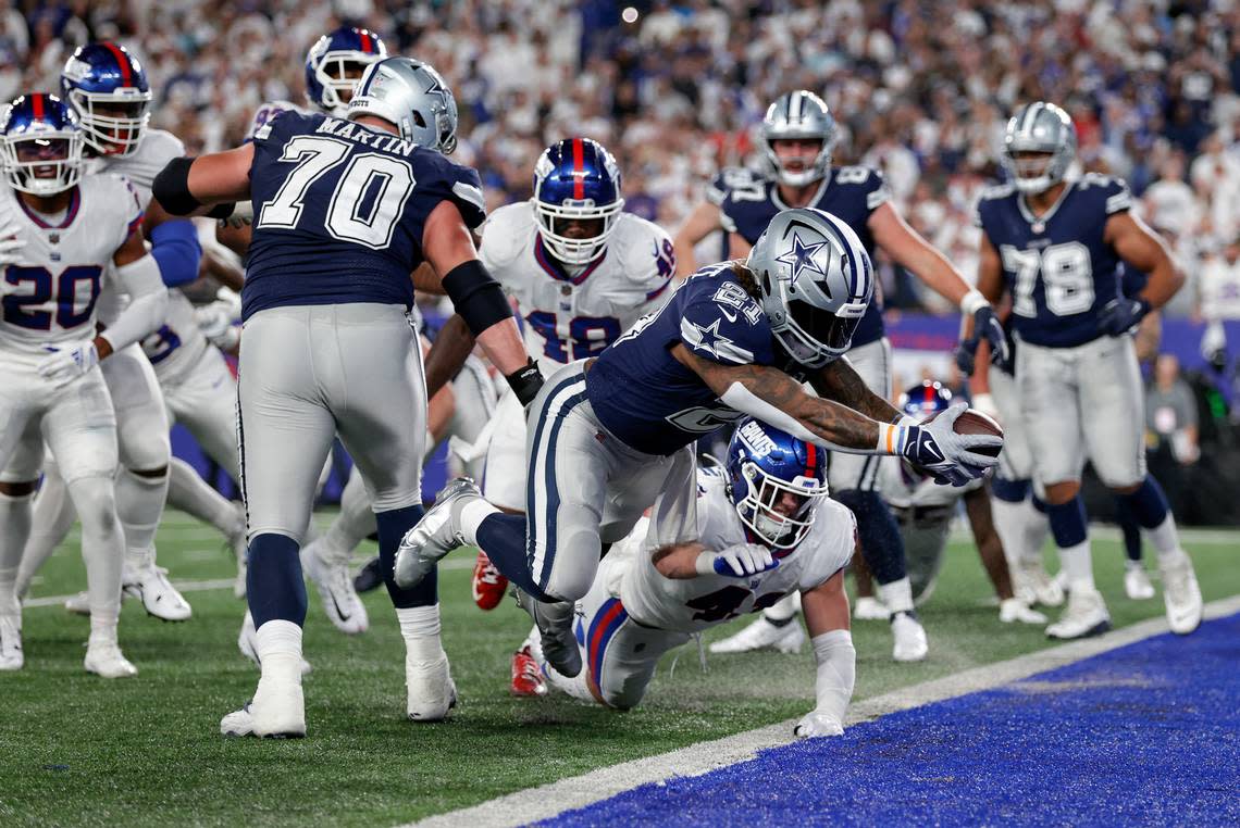 Dallas Cowboys running back Ezekiel Elliott (21) leaps across the goal line for a touchdown against the New York Giants during the third quarter of an NFL football game, Monday, Sept. 26, 2022, in East Rutherford, N.J. (AP Photo/Adam Hunger)