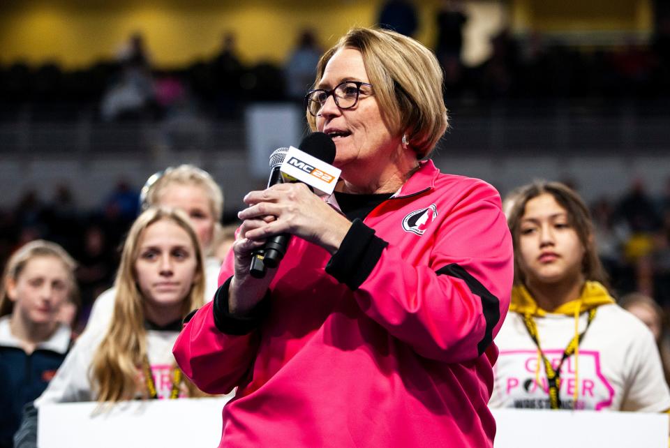 Jean Berger, executive director of the Iowa Girls High School Athletic Union, announces the union has sanctioned girls wrestling before the finals during the third session of the Iowa Wrestling Coaches and Officials Association (IWCOA) girls' state wrestling tournament, Saturday, Jan. 22, 2022, at the Xtream Arena in Coralville, Iowa.