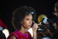 Model Ariela Soares, 27, gets her hair and makeup done backstage at The Blonds fashion show at Spring Place on Wednesday, Sept. 14, 2022, in New York. (AP Photo/Brittainy Newman)