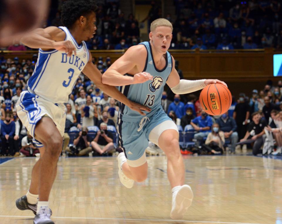 The Citadel Bulldogs guard Tyler Moffe (13) dribbles up court as Duke Blue Devils guard Jeremy Roach (3) defends during the first half at Cameron Indoor Stadium on Nov. 22, 2021.