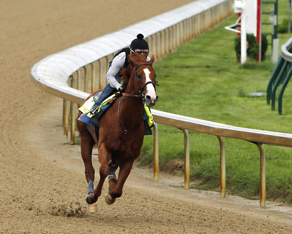 Jockey Martin Garcia works Triple Crown hopeful Justify at Churchill Downs. (AP)