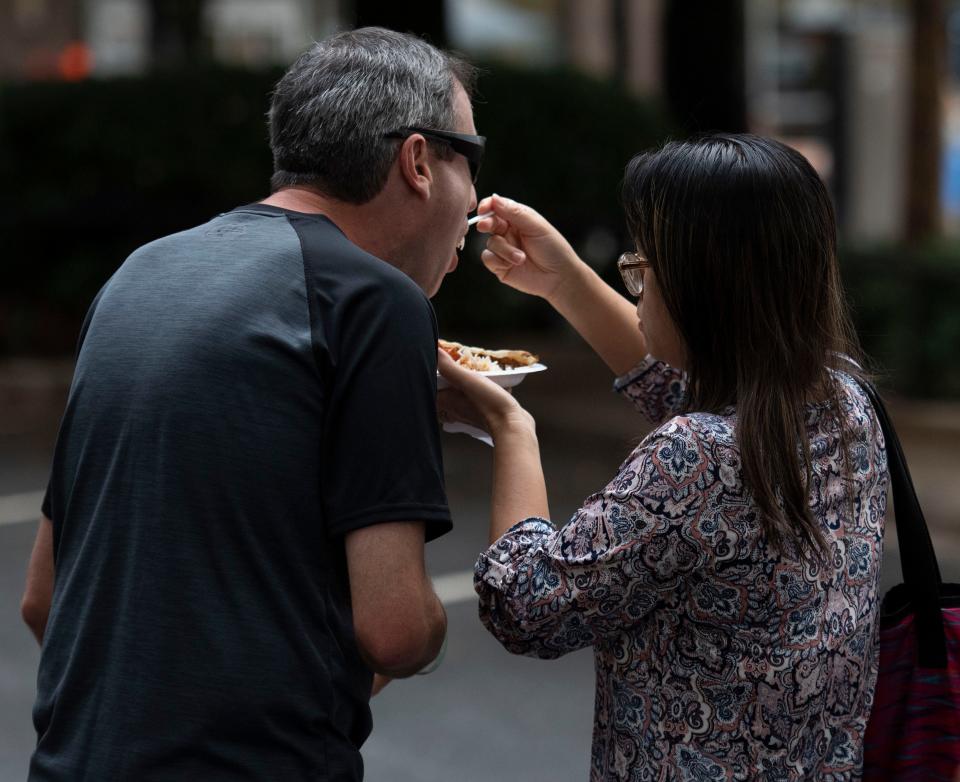 Brad Kippel, of Greenville, is fed a bite of food by his wife, Connie KippleÕs during Fall for Greenville on Friday, October 8, 2021