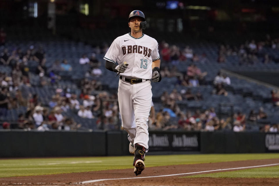 Arizona Diamondbacks' Nick Ahmed rounds the bases after hitting a solo home run against the Miami Marlins during the second inning of a baseball game, Tuesday, May 11, 2021, in Phoenix. (AP Photo/Matt York)