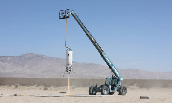 Xaero-B, a prototype launch vehicle built by the company Masten Space Systems in Mojave, California, takes a tethered test flight in this image released on July 17, 2014. Masten Space Systems is one of three companies working on designs for the