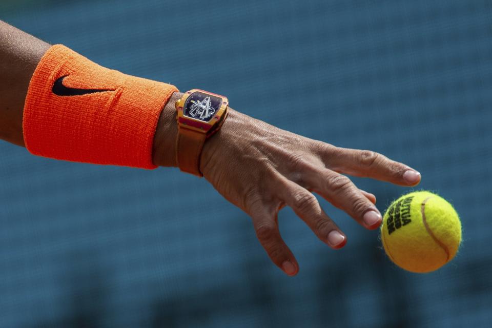 Rafael Nadal, from Spain, serves to Felix Auger-Aliassime, from Canada, during the Madrid Open tennis tournament in Madrid, Wednesday, May 8, 2019. (AP Photo/Bernat Armangue)