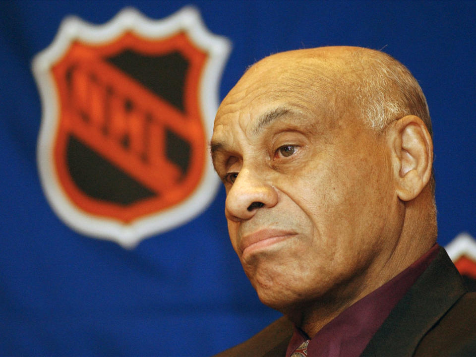 FILE - In this March 25, 2003, file photo, Willie O'Ree, the NHL's first black player and current NHL director of youth development is seen prior to being presented with the 2003 Lester Patrick Award, in Boston. The Boston Bruins say they are retiring the jersey of Willie O’Ree, who broke the NHL’s color barrier. O’Ree will have his jersey honored prior to the Bruins’ Feb. 18 game against the New Jersey Devils. He became the league’s first Black player when he suited up for Boston on Jan. 18, 1958 against the Montreal Canadiens, despite being legally blind in one eye. AP Photo/Patricia McDonnell, File