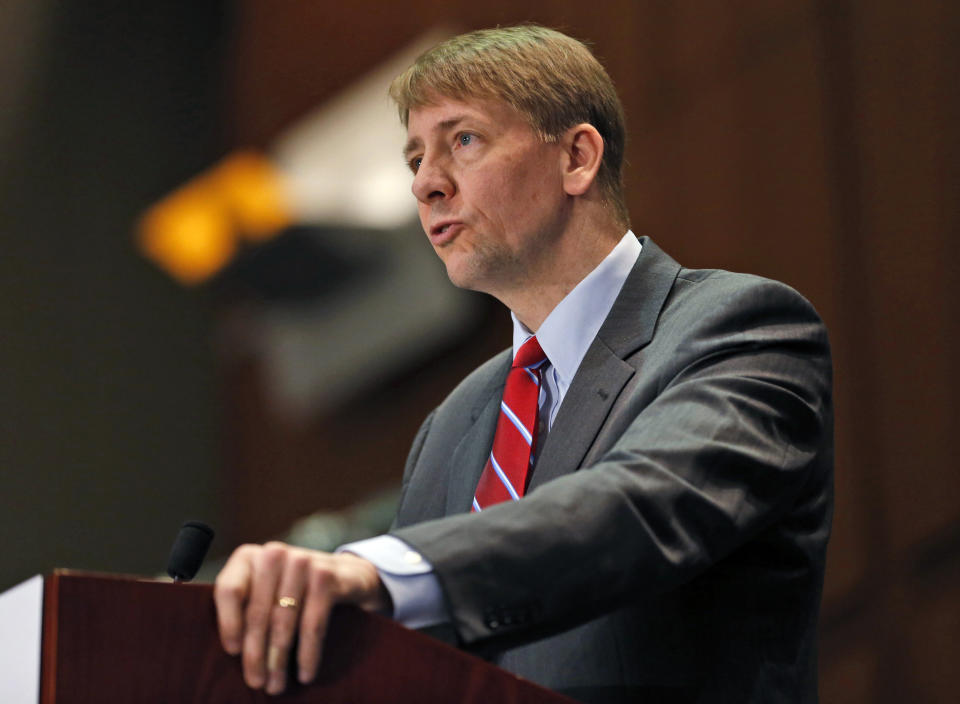 FILE - In this March 26, 2015, file photo, Consumer Financial Protection Bureau Director Richard Cordray speaks during a panel discussion in Richmond, Va. The Consumer Financial Protection Bureau has proposed a massive overhaul of the multibillion dollar debt-collection industry. The changes released Thursday, July 28, 2016, would restrict collectors from calling numerous times a day, require them to more substantially prove a debt is valid, and give people more ability to dispute their bills. The CFPB is also proposing a 30-day waiting period on collection attempts for loans tied to a person who has recently died. (AP Photo/Steve Helber, File)